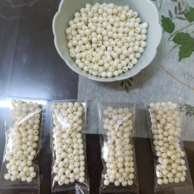 Cuentas plásticas de 6mm color blanco hueso