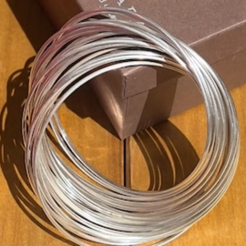 Juego de pulseras plateada