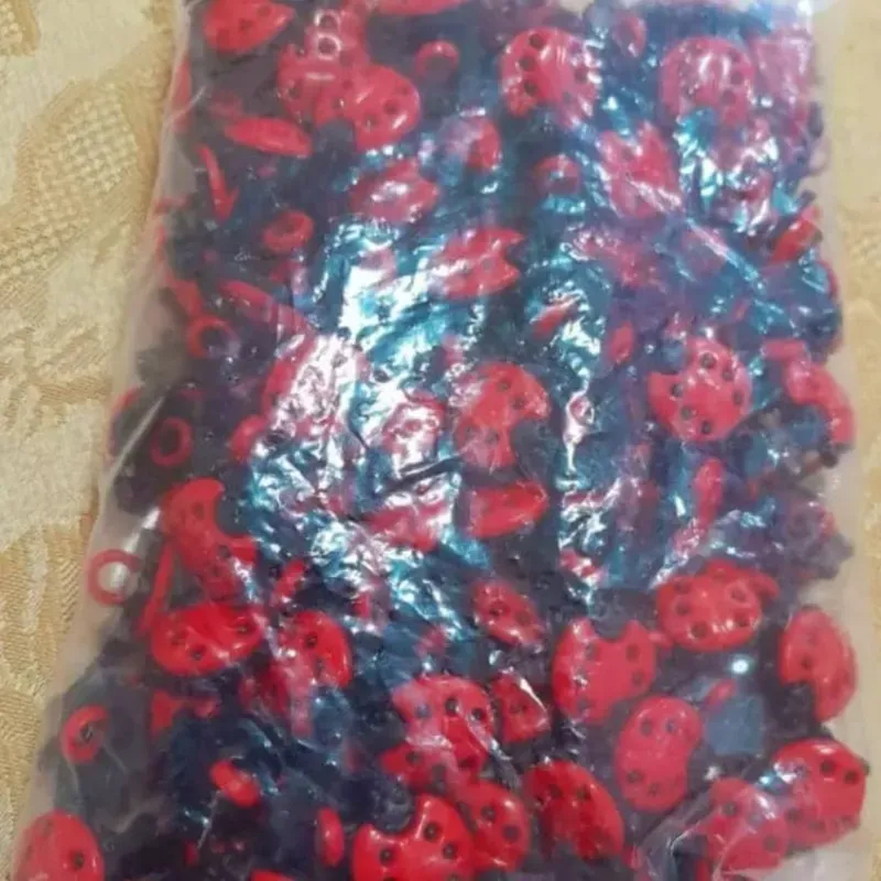 Botón forma de mariquita