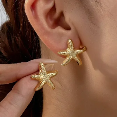 Aretes de estrella de mar dorados