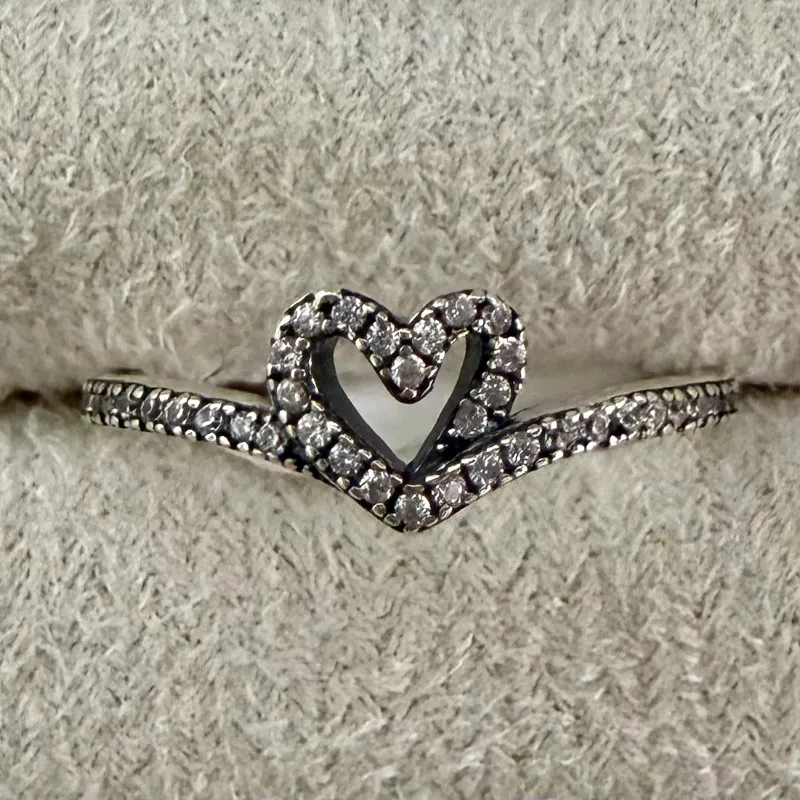 Anillo corazón entrelazado