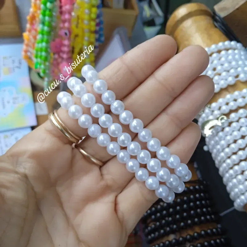 Pulsa de perlas blanca