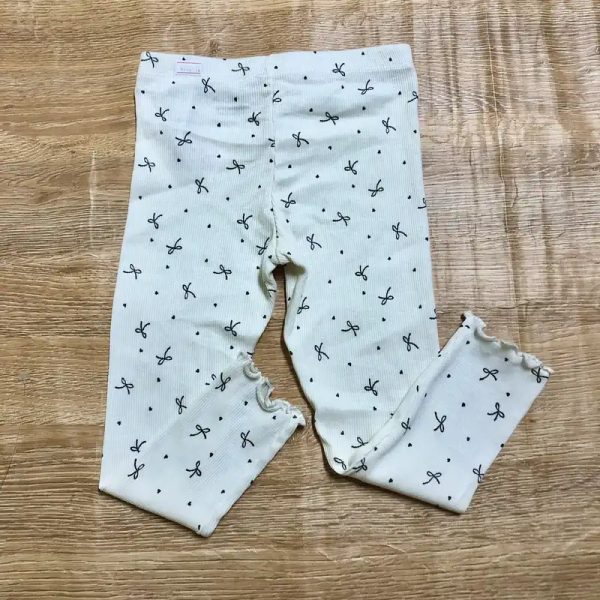 Legging blanco con lazos negros
