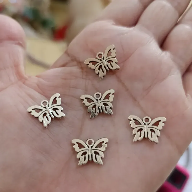 Dije en forma de  mariposa