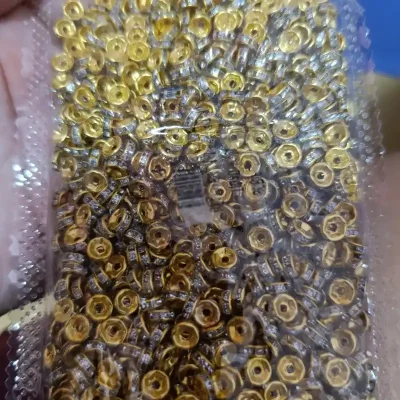 Separador o rondel de 6mm dorado con incrustaciones