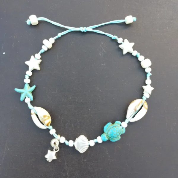 Tobillera azul y blanca con perlas