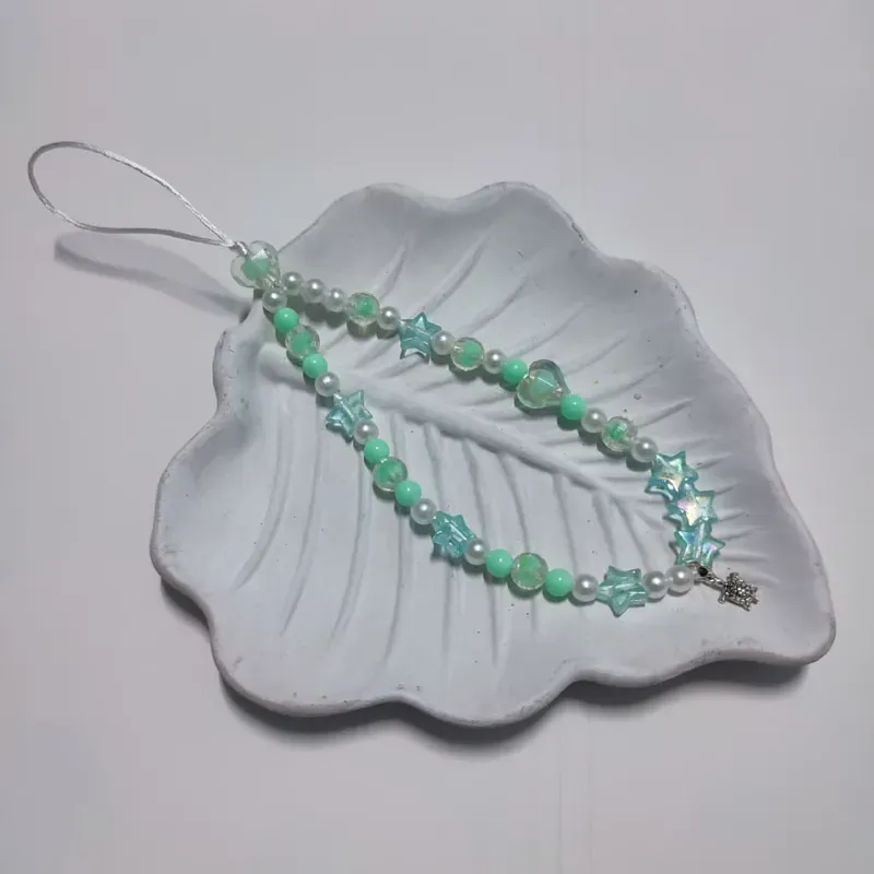 Colgante de teléfono con dije