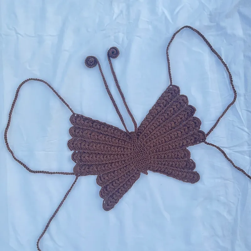 Top mariposa con abanicos