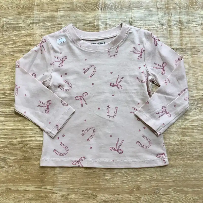 Enguatada rosada con lazos y herraduras