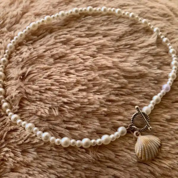 Collar de perlas y cierre OT