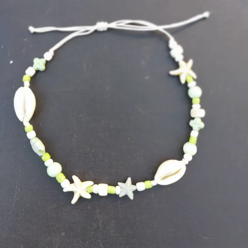 Tobillera verde y blanca