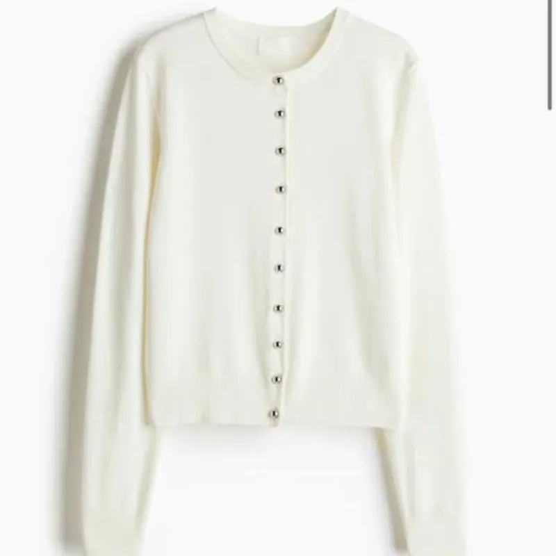 Abrigo blanco con botones