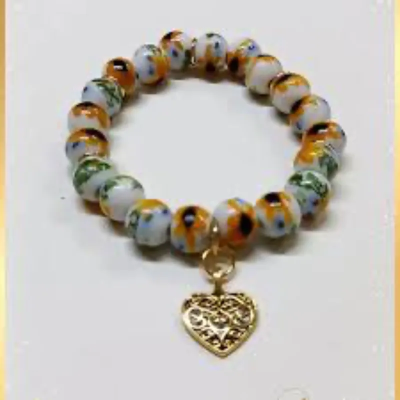 Cuentas de girasol de cristal con dije de corazón dorado