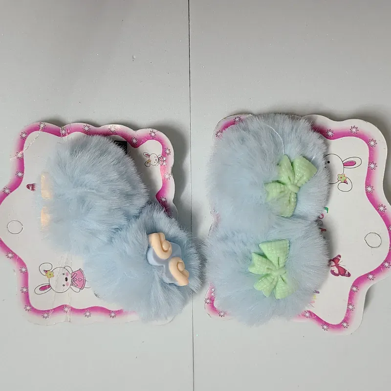 Pareja de pompones en hebilla