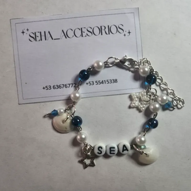 Pulsera de acero con dijes