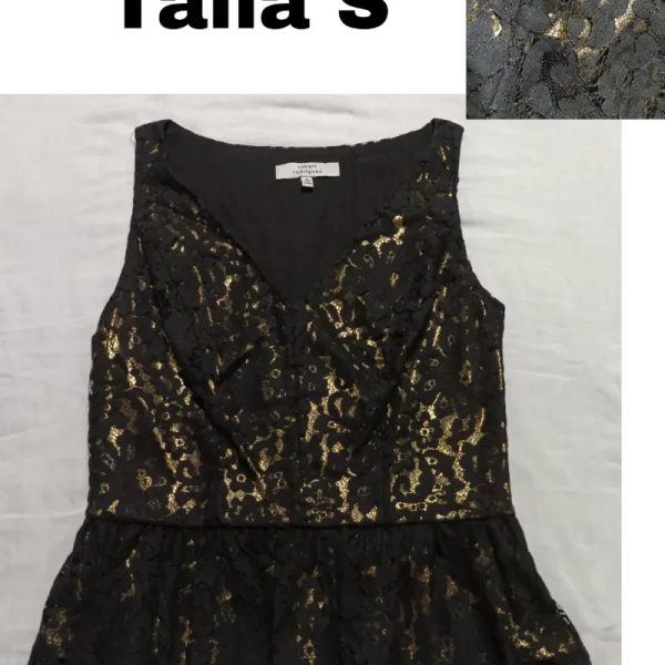 Blusa Negra de encaje y dorada.