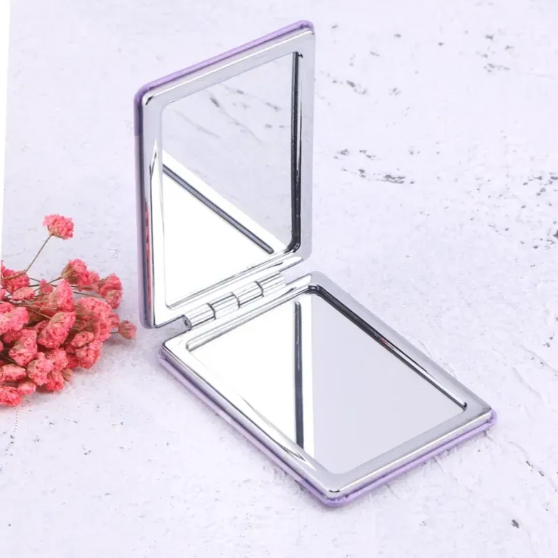 Espejo plegable con aumento