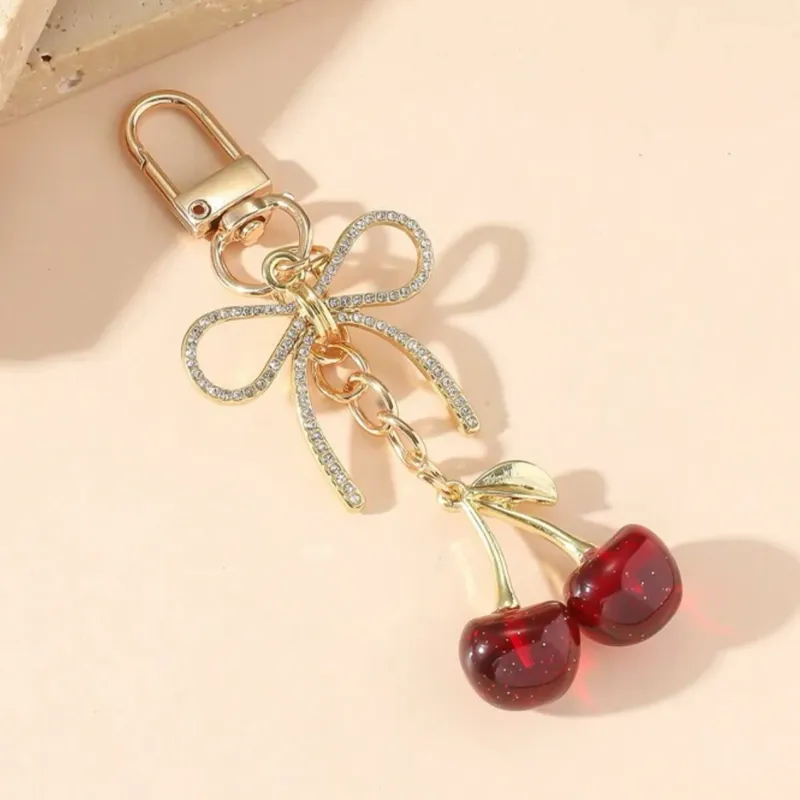 Llavero de Cherry rojo y dorado con Lazo