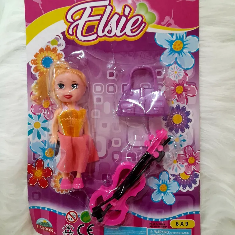 Juguete Barbie con violín  y bolso 