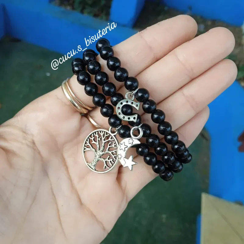 Pulsa de perlas con dije