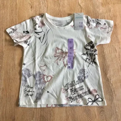 Pulóver color crema con dibujos