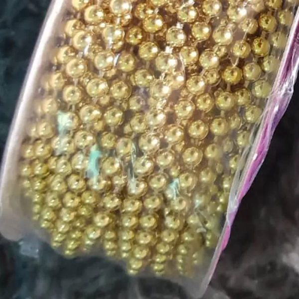 Tira perlas doradas