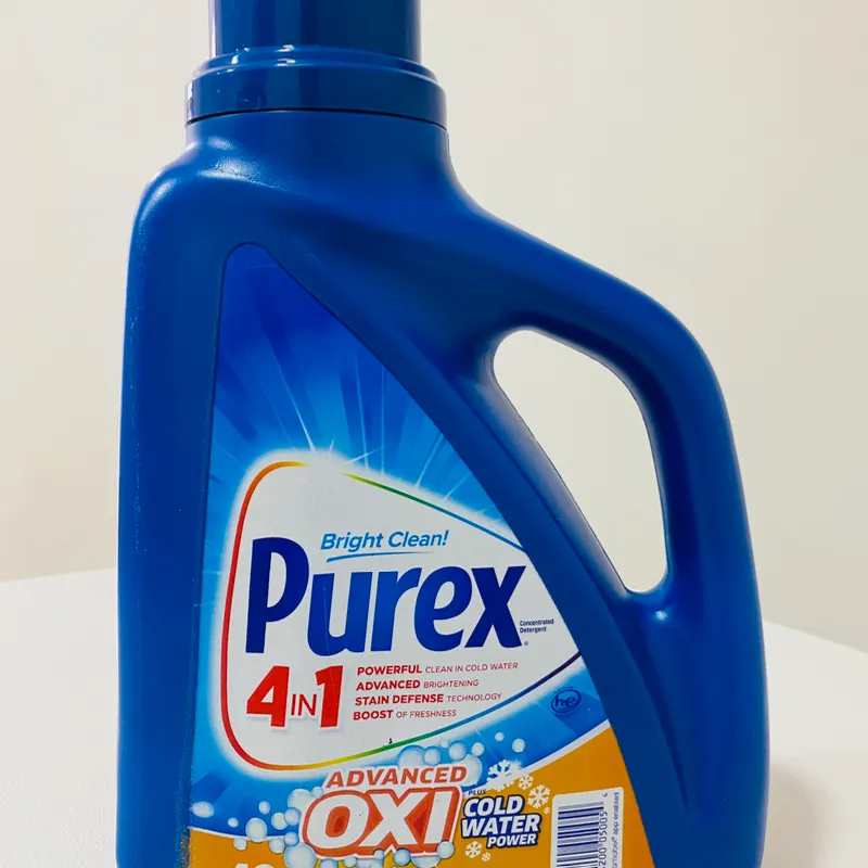 Sobre de Tide blanco y pomo Purex