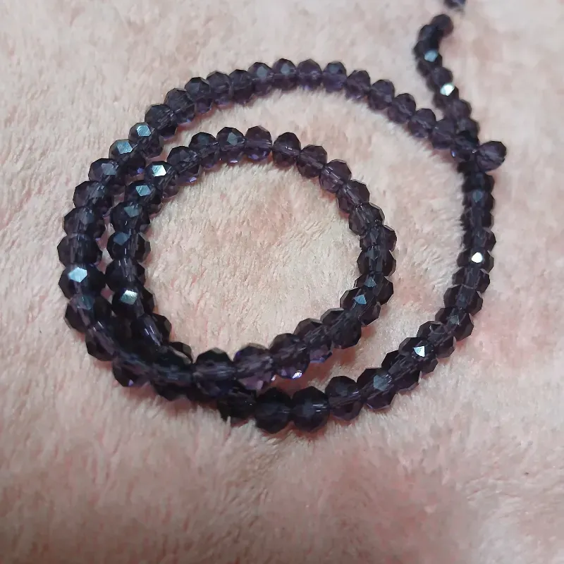 Swaroskis tira 6 mm morado oscuro transparente