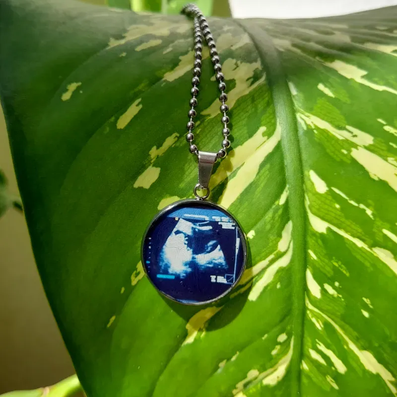 Collar con dije encapsulado con fotografia 1