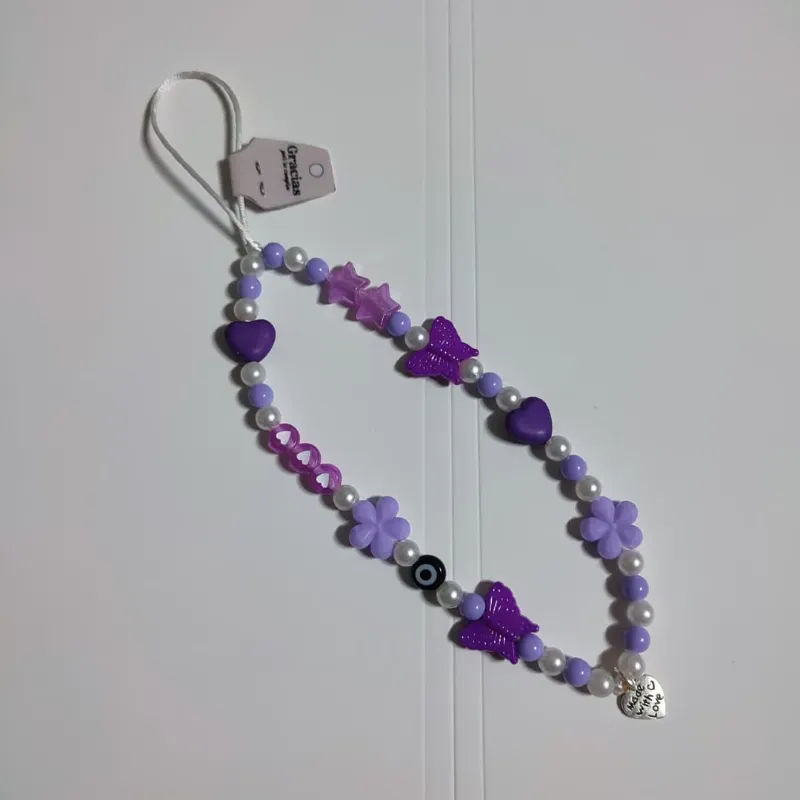 Colgante de telefono morado con ojo turco