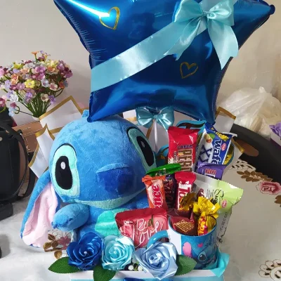 Caja con peluche y globo