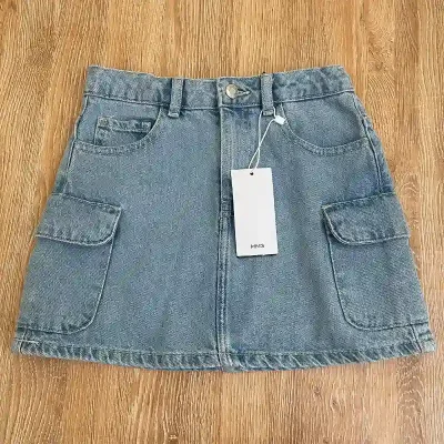 Saya Mango con bolsillos a los lados