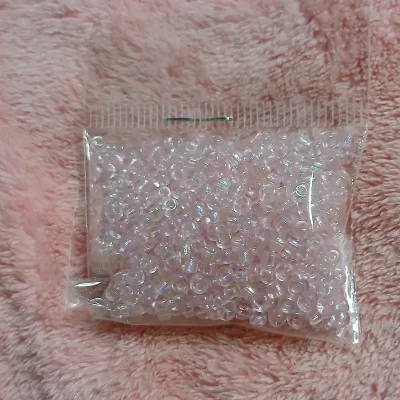 Mostacillas rosa claro tornasol transparente