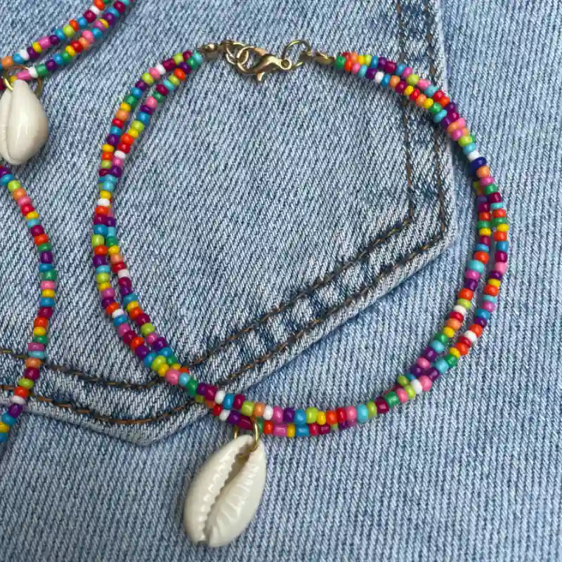 Tobillera doble con dije de caracol