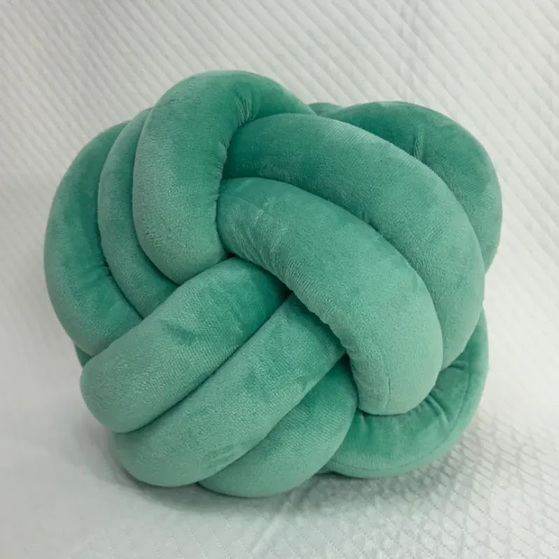 Cojín en forma de nudo