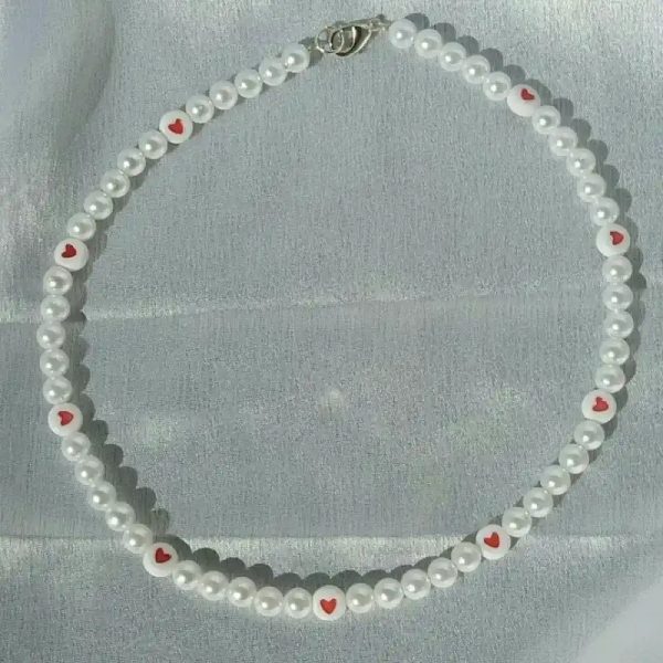 Collar de perlas con ❤