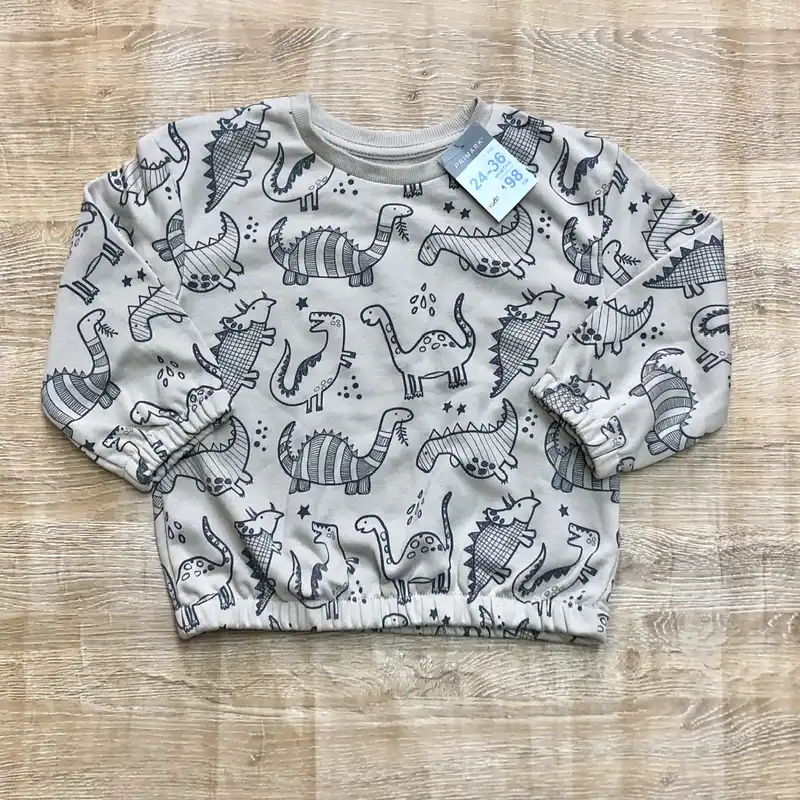 Abrigo con dinosaurios color beige