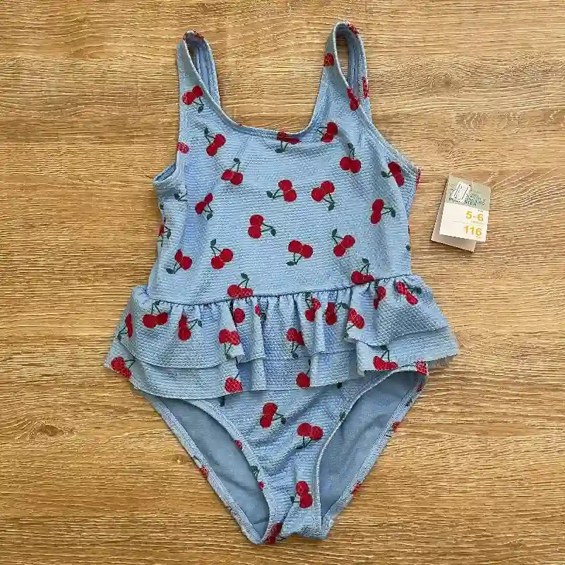 Trusa color azul con vuelo y cerezas