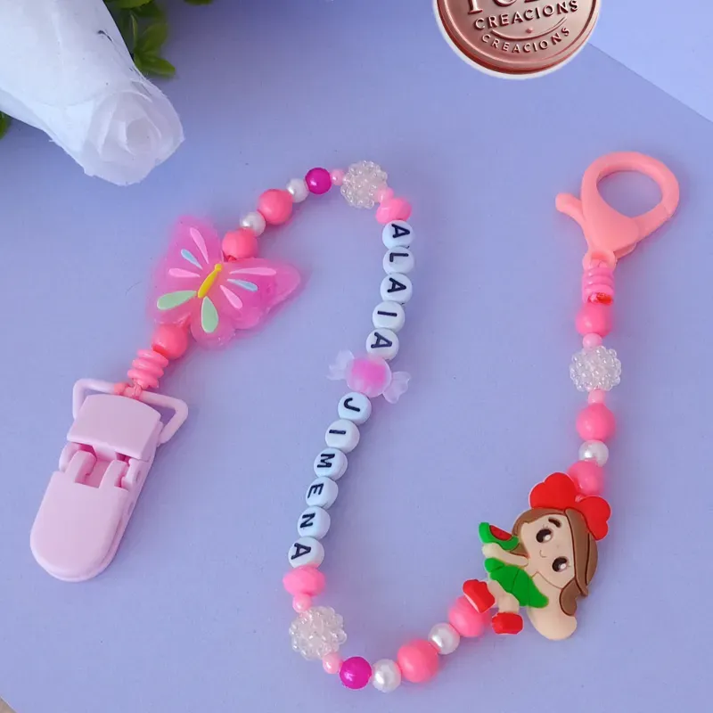 Chupetero de mariposa y muñeca