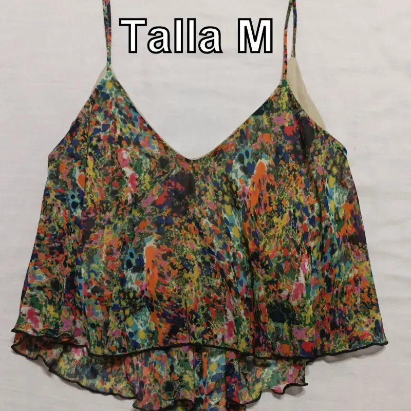 Blusa corta de tirante con punticos de colores.