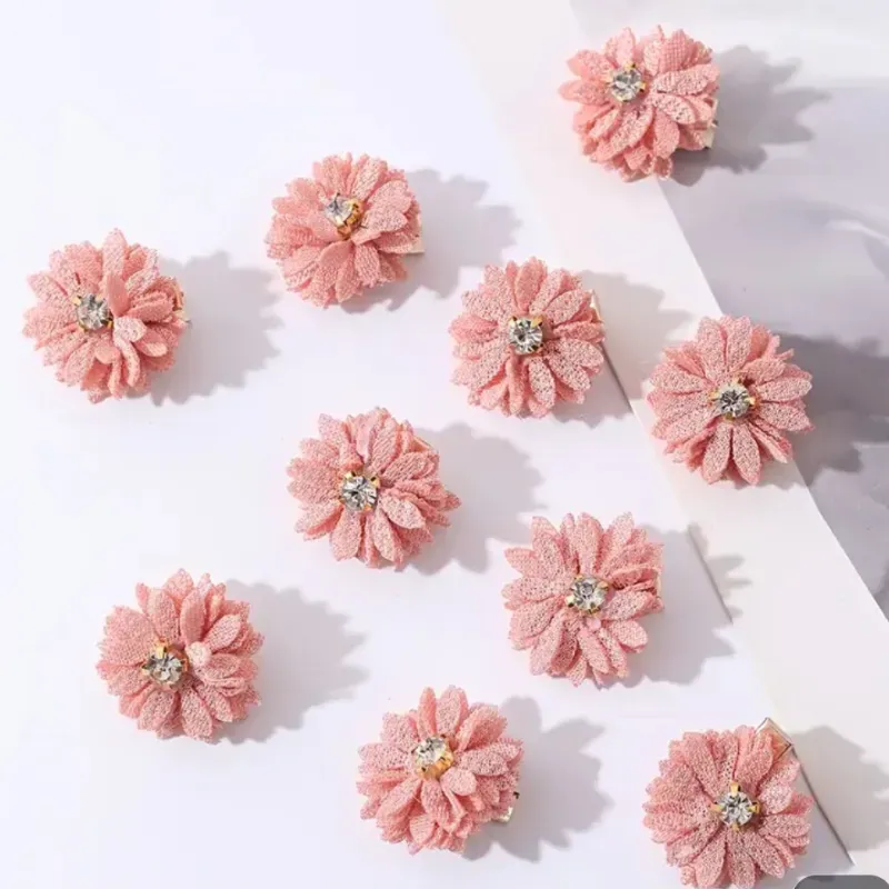 Horquillas para el cabello con flores de tela rosadas