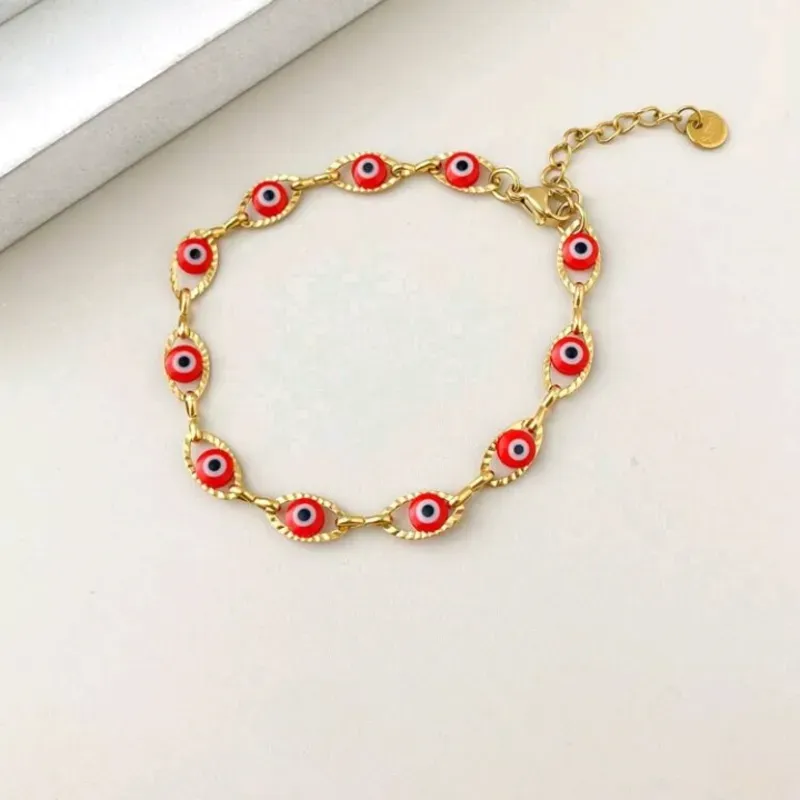 Pulsera de ojos turcos rojos de acero inoxidable con un baño de oro