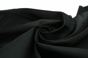 TEJIDO DE FORRO "NON WOVEN", 1.50M (60") DE  ANCHO, 100% POLIÉSTER, LISO COLOR NEGRO